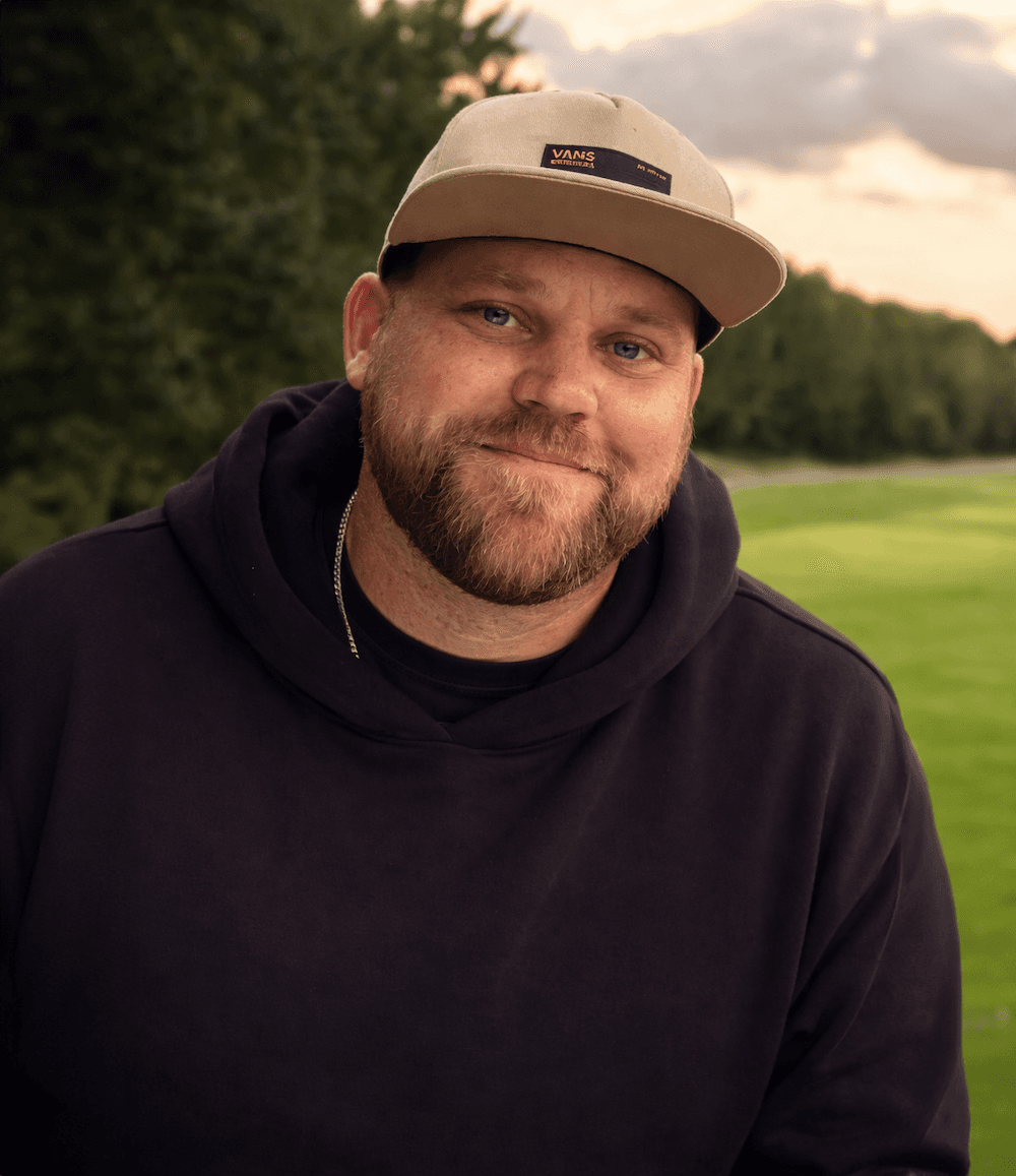 man crossing arms in front of chest 
