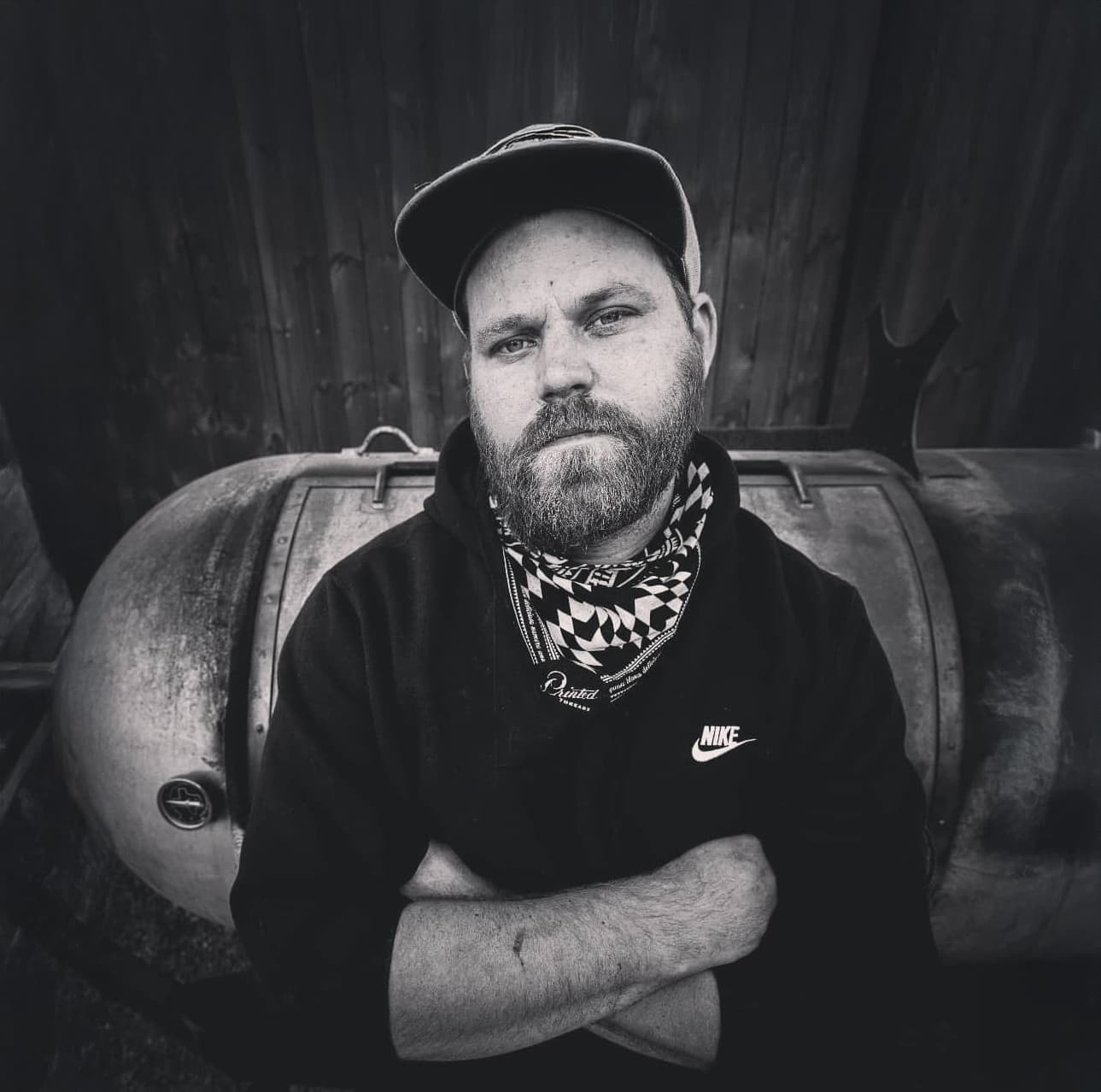 man crossing arms in front of chest