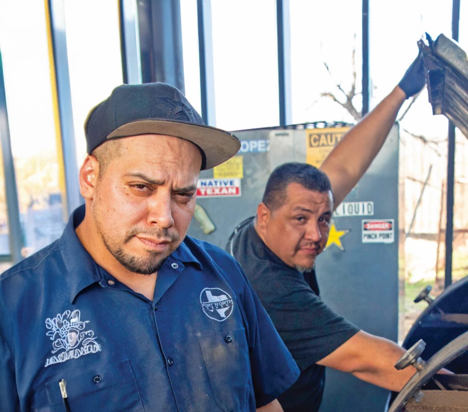 men in front of grill